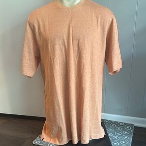 Burberrys heather light orange pique V neck short sleeve shirt. 100% cotton. XL